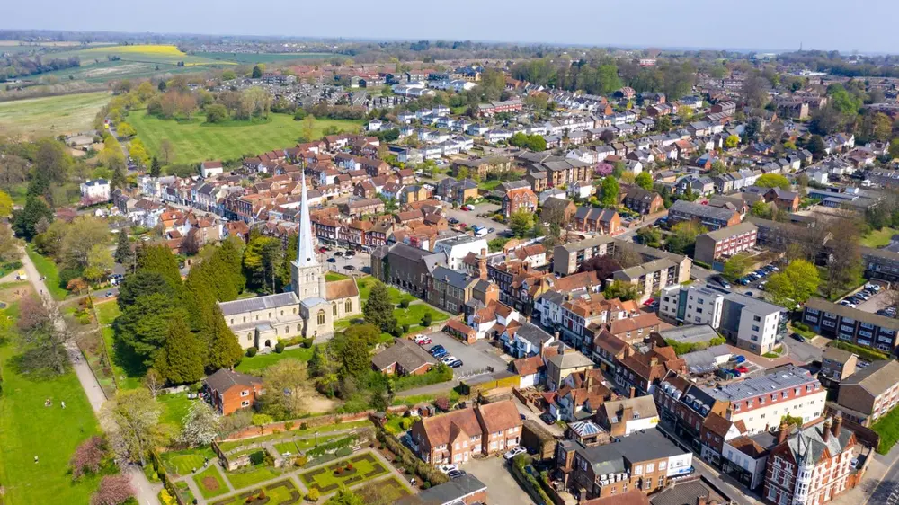 Aerial view of a Hertfordshire village with its church and surrounding fields